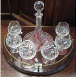 Cut lead crystal glass decanter set to include Ship's-type decanter and six matching brandy
