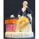 Two items of 19th century Staffordshire pottery to include: 'Mr Dick' from Dickens' novels seated