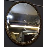 Gilt framed oval bevel plate mirror. (B.P. 24% incl.