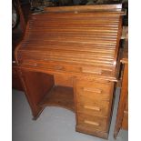 Early 20th century oak 'S' roll tambor single pedestal desk. (B.P. 24% incl.