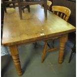 Modern pine farmhouse table of rectangular form, standing on baluster turned supports,