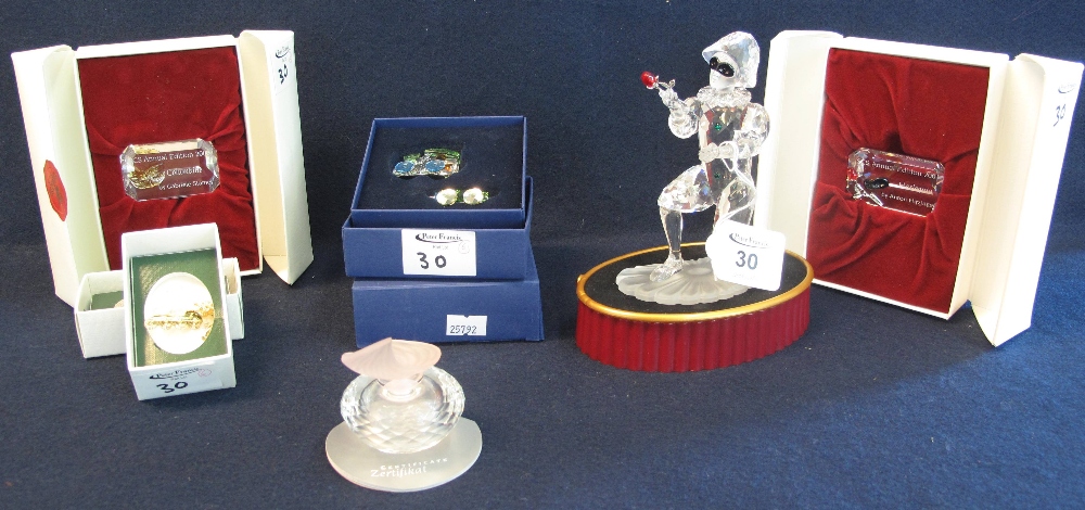 A group of assorted Swarovski crystal items to include: roller skate, figure, train,