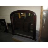 Late 19th/early 20th century mahogany framed, domed over-mantle mirror. (B.P. 24% incl.