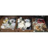 Two boxes of assorted china to include floral teaware, various cow creamers and china animals,