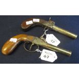 Two similar 19th century percussion pocket pistols; both brass, one with turn off barrel,
