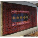 Modern Middle Eastern design hand knotted geometric rug on a blue and red ground.