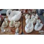 Two trays of ceramic swan lustre and other spill type vases together with a glass frosted swan and