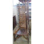 Pair of possibly Malaysian hardwood, high ladder back, rustic open arm chairs. Water damaged.