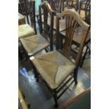 Pair of camel-back kitchen chairs with rush seats on turned supports. (2) (B.P. 24% incl.