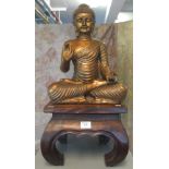 Gilded wooden figure of the Buddha seated in Lotus position giving Mudra of peace,