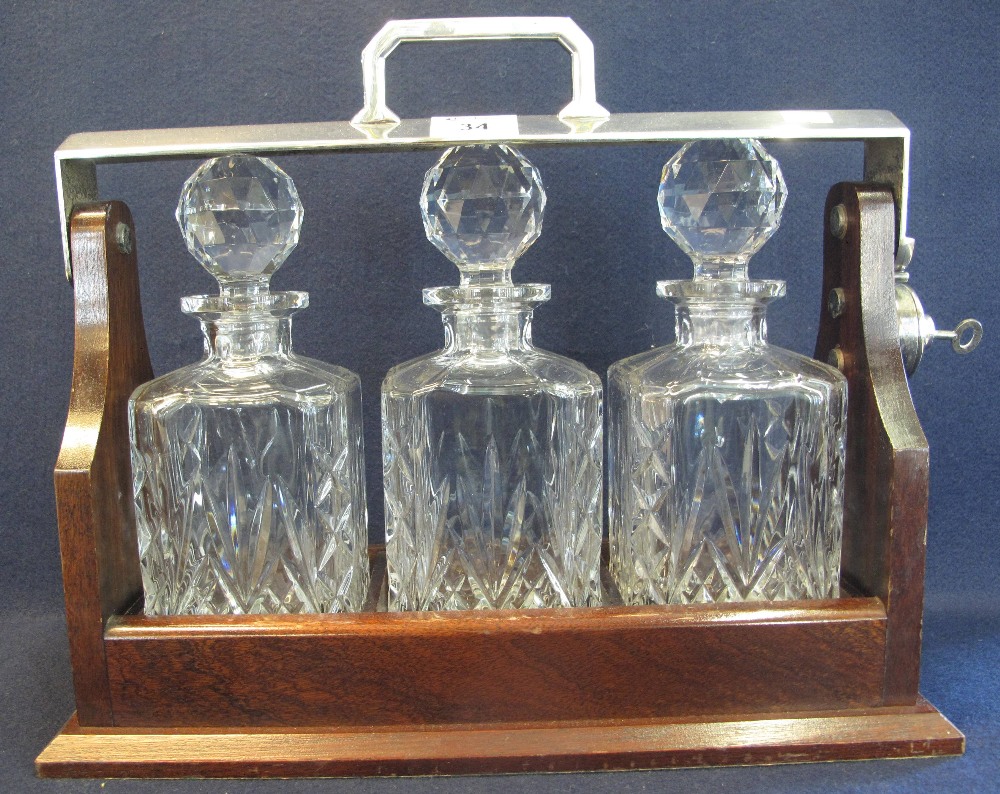 Modern mahogany three bottle tantalus with plated mounts and three square section spirit decanters - Image 2 of 2