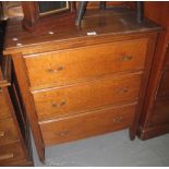 Mid 20th century oak, straight front chest with three drawers on square tapering legs and casters.