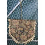 Foliate and floral tapestry shield-shaped banner on gilt, brass bracket. (B.P. 24% incl.