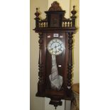 Early 20th century stained, two-train Vienna-type wall clock with key and pendulum. (B.P. 24% incl.