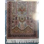 A small Persian silk floral rug. (B.P. 24% incl.