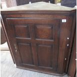 Early 19th century Welsh oak blind paneled, hanging corner cupboard with four fielded panels. (B.P.