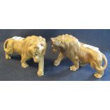 Two carved wooden figures of African male lions. 20 cm long approx. (B.P. 24% incl.