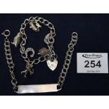 Silver charm bracelet and an identity bracelet. (B.P. 24% incl.