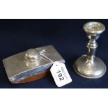 Single silver dwarf candle stick with loaded base, together with a silver topped,