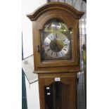 Modern oak long case clock having silver dial with Roman numerals and three weights. (B.P. 24% incl.
