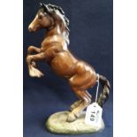 Beswick 1014 bone china rearing horse on a naturalistic base. (B.P. 24% incl.