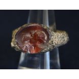 Glass cameo set in a rock ring. (B.P. 24% incl.