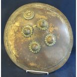 Leather covered Indian DHAL shield with gilt metal bullions and mounts. 42 cm diameter approx. (B.P.