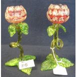 Pair of coloured glass, tulip shaped vases with green stems and leaves and pink glass flower heads.