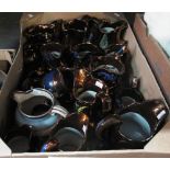 Box of mainly copper lustre dresser jugs, varying forms. (B.P. 24% incl.