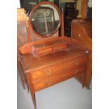 Edwardian mahogany mirror-back dressing table with two drawers, on square tapering legs and casters.