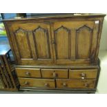 Late 18th Century Welsh oak low linen press cupboard with four ogee panels above an arrangement of