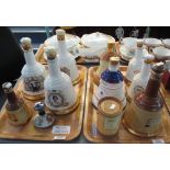 Two trays of mainly commemorative and other Wade Bells whisky decanters all sealed,