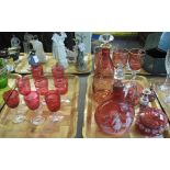 Two trays of cranberry glass items to include: set of eight wine glasses,