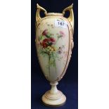 Royal Worcester peach ground, urn shaped pedestal vase with hand painted floral decoration.