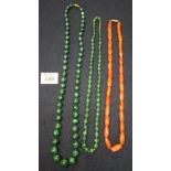 String of green hard stone beads, string of malachite beads and a string of carnelian beads. (B.P.