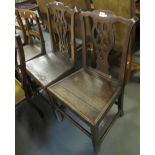 Two similar 19th century oak, Chippendale style farmhouse kitchen chairs.
