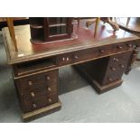 Victorian mahogany knee hole desk with a leather insert top and three drawers to each pedestal. (B.