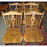 A set of four modern hardwood spindle and slat back kitchen chairs. (4) (B.P. 24% incl.