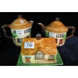 Three Beswick ware cottage items to include; two teapots and a butter dish and cover. (3) (B.P.