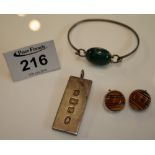 A silver ingot, amber earrings and a bracelet. (B.P. 24% incl.