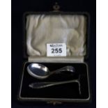 Cased silver child's christening set pusher and loop handled spoon. Birmingham hallmarks. (B.P.