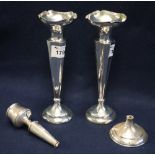 Pair of silver inverted conical vases with circular loaded bases,