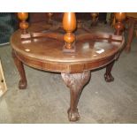 Victorian circular extending dining table on carved cabriole legs and ball and claw feet.