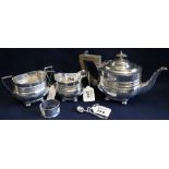 Silver three piece bachelor's tea service of baluster form on bun feet,