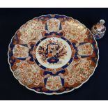 Large Japanese porcelain Arita Imari design charger having indented rim and being decorated with