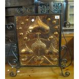 Arts and Crafts organic design copper firescreen with a later wrought iron frame. (B.P. 24% incl.