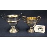 Two small silver two handled pedestal trophy cups, one marked 'Pet dog show'.