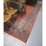 20th Century Persian design red ground foliate carpet. 360 x 259cm approx. (B.P. 24% incl.