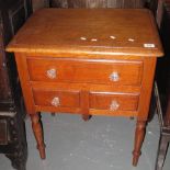 19th Century oak side or lamp table, having an arrangement of three drawers with glass handles. (B.