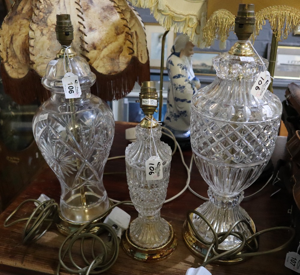 Three similar glass vase shaped table lamp bases with brass stands. (3) (B.P. 24% incl.